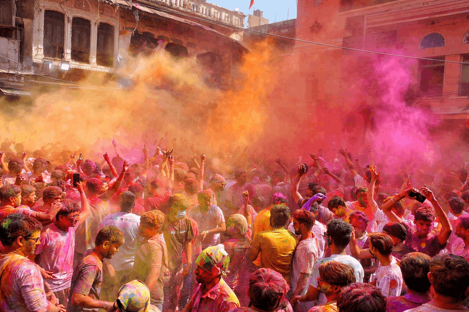 People playing Holi with colorful powders in Pushkar streets